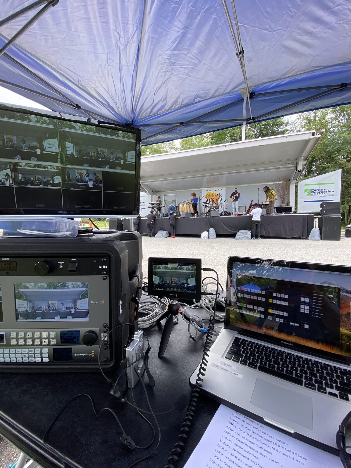 On-site, under a tent — same production values.